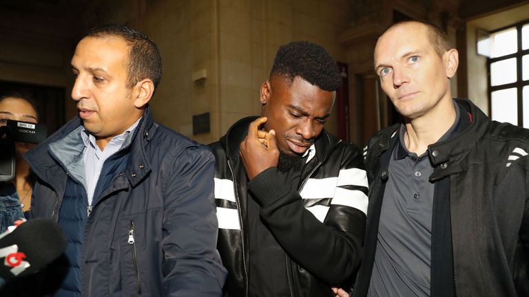 Aurier (middle) arrives at the Paris courthouse to answer the charge of elbowing a police officer