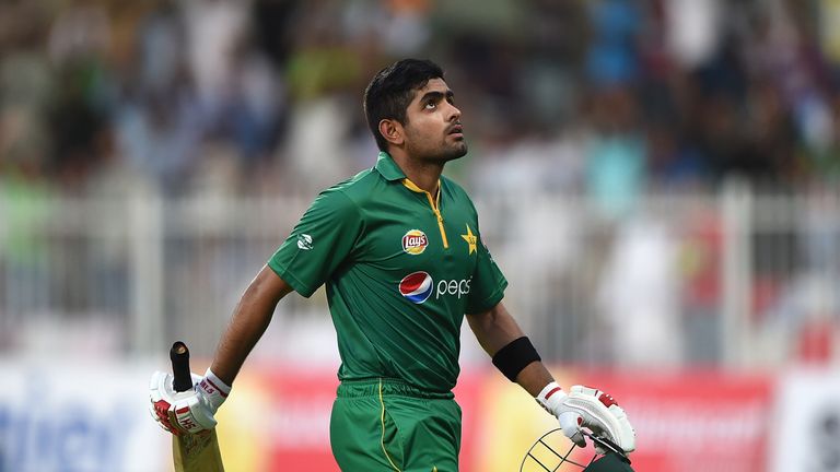 SHARJAH, UNITED ARAB EMIRATES - SEPTEMBER 30:  Babar Azam of Pakistan leaves the field after being dismissed by Kieron Pollard of West Indies during the fi