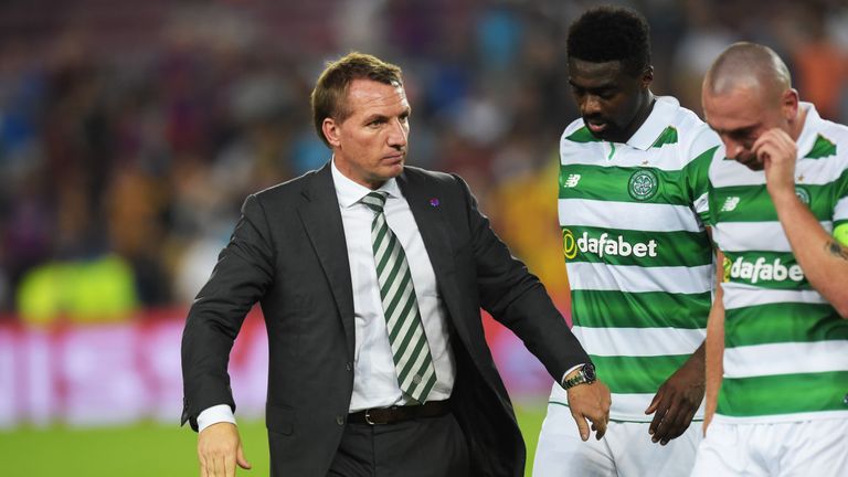 Brendan Rodgers comforts his players after they were thrashed by Barcelona