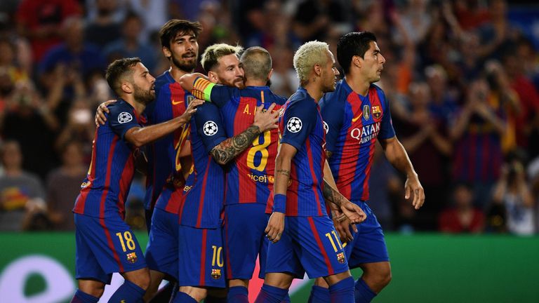 Lionel Messi of Barcelona celebrates scoring his third and his side's fifth goal with team mates 