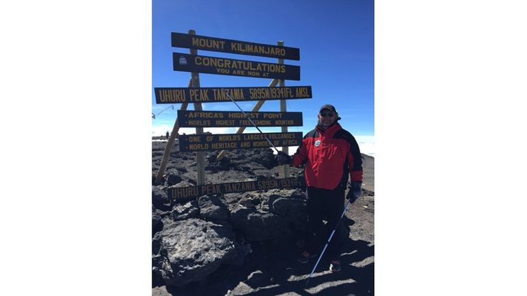 Barrie McDermott at the top of Kilimanjaro