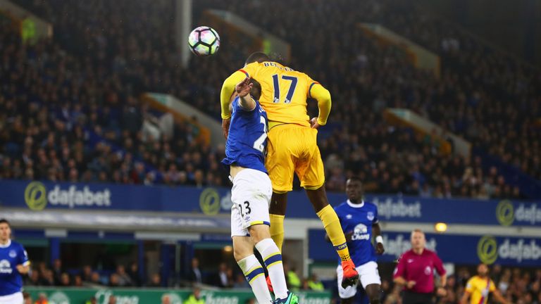 Christian Benteke of Crystal Palace outjumps Seamus Coleman of Everton as he scores their first goal during the Premier League match at Goodison