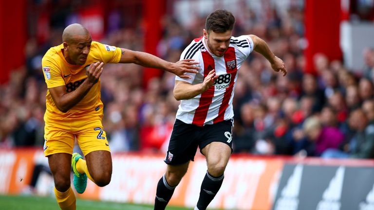 Scott Hogan gets away from Alex Baptiste