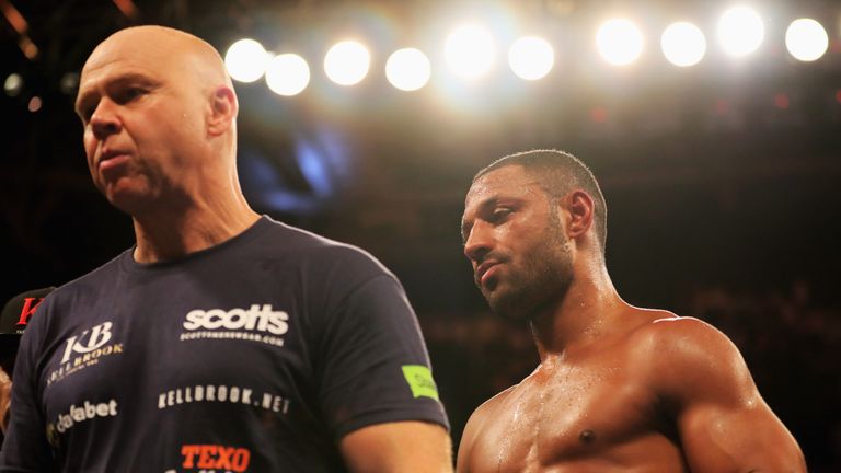LONDON, ENGLAND - SEPTEMBER 10:  Kell Brook and trainer Dominic Ingle look on in defeat to Gennady Golovkin after their World Middleweight Title contest at