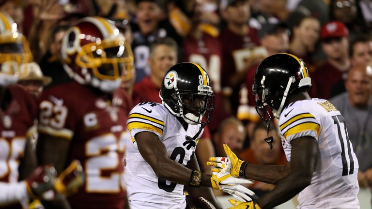 LANDOVER, MD - SEPTEMBER 12: Wide receiver Antonio Brown #84 of the Pittsburgh Steelers celebrates with teammate wide receiver Eli Rogers #17 after scoring