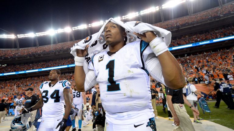 DENVER, CO - SEPTEMBER 08:  Quarterback Cam Newton #1 of the Carolina Panthers walks off the field after the Panthers lose to the Denver Broncos 21-20 at S