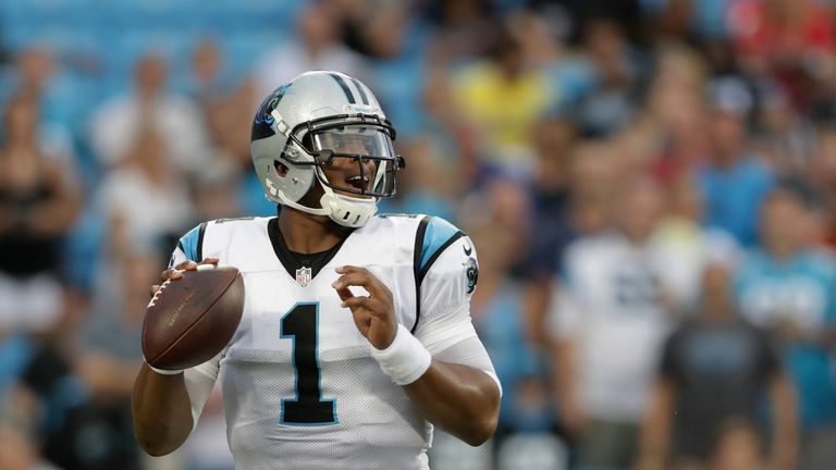 CHARLOTTE, NC - AUGUST 26:   Cam Newton #1 of the Carolina Panthers drops back to pass against the New England Patriots in the 1st quarter during their gam