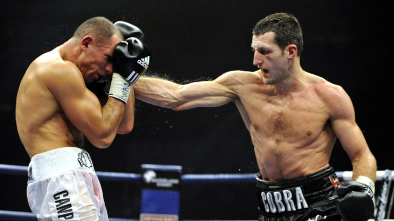 Britain's Carl ' The Cobra' Froch (R) fights against Germany's 'King' Arthur Abraham during their WBC super-middleweights title