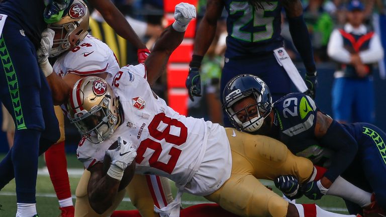 SEATTLE, WA - SEPTEMBER 25:  Running back Carlos Hyde #28 of the San Francisco 49ers rushes for a touchdown in the fourth quarter against the Seattle Seaha