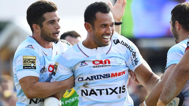Racing 92 centre Casey Laulala (C) is congratulated by Racing 92's French fullback Brice Dulin (L) after scoring against Toulon, September 2016