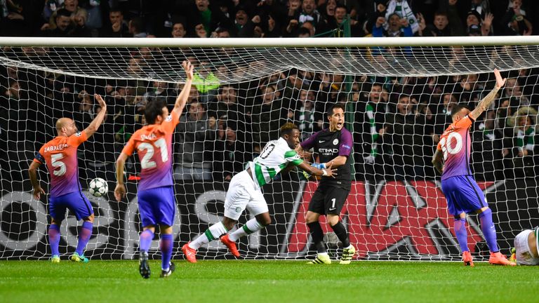 Celtic's Moussa Dembele (centre) wheels away to celebrate his goal