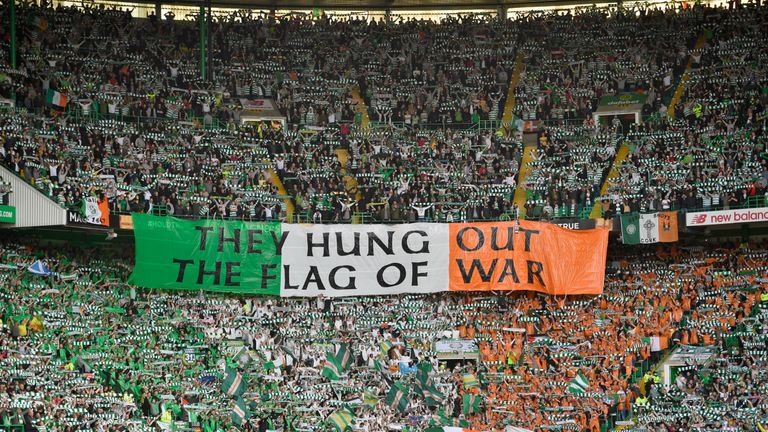 Celtic fans hold up a banner during the Ladbrokes Scottish Premier league match between Celtic and Rangers 