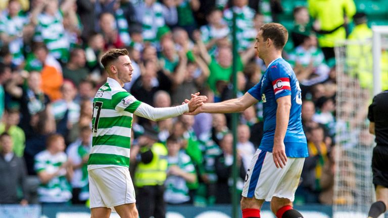 Celtic's Patrick Roberts (left) shakes hands with Rangers captain Lee Wallace