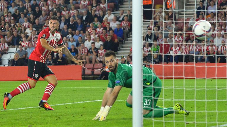 Southampton's English striker Charlie Austin (L) turns to celebrate scoring their second goal during the UEFA Europa League group K football match 