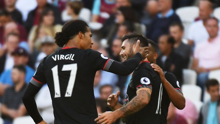 Charlie Austin of Southampton (10) celebrates with Virgil van Dijk (17) as he scores their first goal during the Premier League match at West Ham