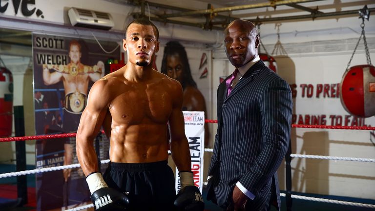 Chris Eubank Jr and his father pose in the gym