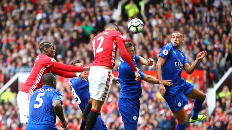 Chris Smalling of Man United scores with a header against Leicester