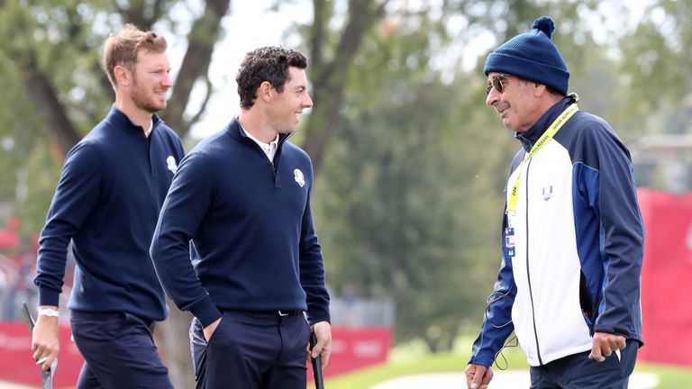 Rory McIlroy and vice-captain Sam Torrance speak during practice prior to the 2016 Ryder Cup