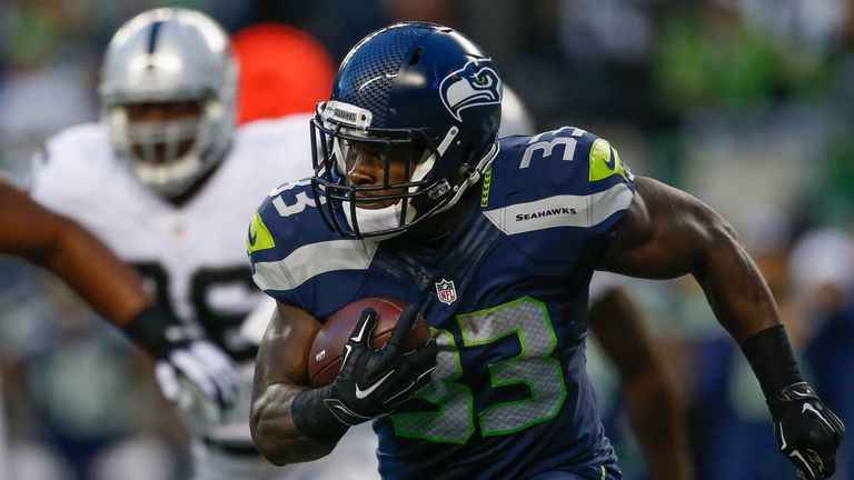 SEATTLE, WA - SEPTEMBER 03:  Running back Christine Michael #33 of the Seattle Seahawks rushes against the Oakland Raiders at CenturyLink Field on Septembe