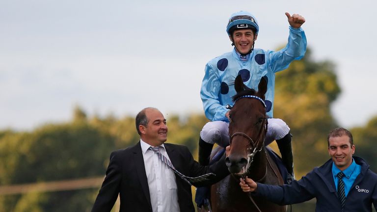 Christophe Soumillon celebrates after riding Almanzor