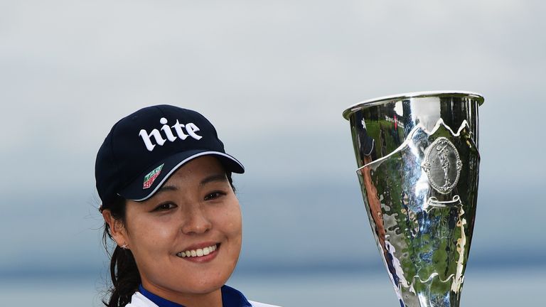 In Gee Chun of Korea holds the trophy after winning The Evian Championship