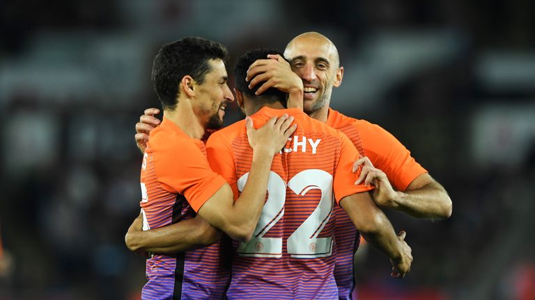 SWANSEA, WALES - SEPTEMBER 21:  Gael Clichy of Manchester City celebrates scoring his sides first goal with team mates during the  EFL Cup Third Round matc