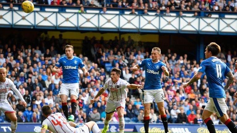 Rangers' Clint Hill (second from right) sees his effort cleared off the line