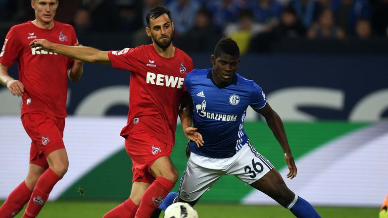 Cologne's Alabanian defender Mergim Mavraj and Schalke's Swiss midfielder Breel Embolo (R) vie for the ball during the German first division Bundesliga foo