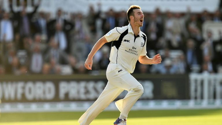 Toby Roland-Jones of Middlesex celebrates taking the wicket of Ryan Sidebottom of Yorkshire to win the title