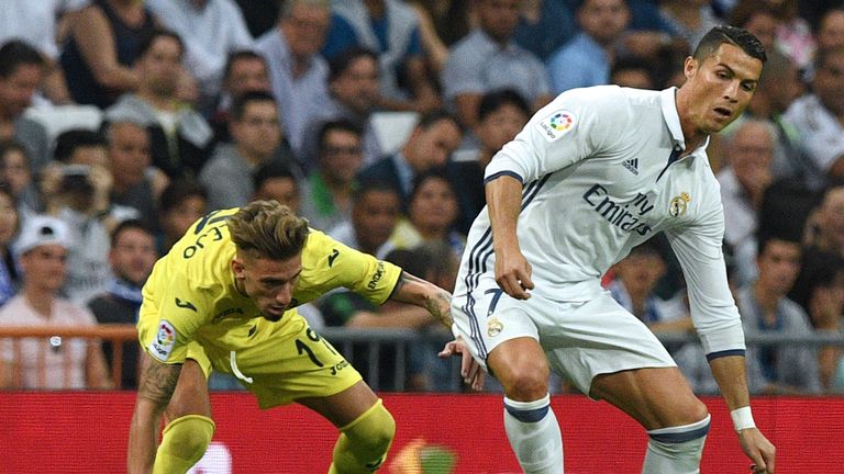 Real Madrid forward Cristiano Ronaldo (right) vies with Villarreal midfielder Samuel Castillejo 
