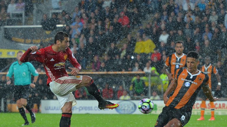 Henrikh Mkhitaryan of Manchester United has his shot blocked by Davies 