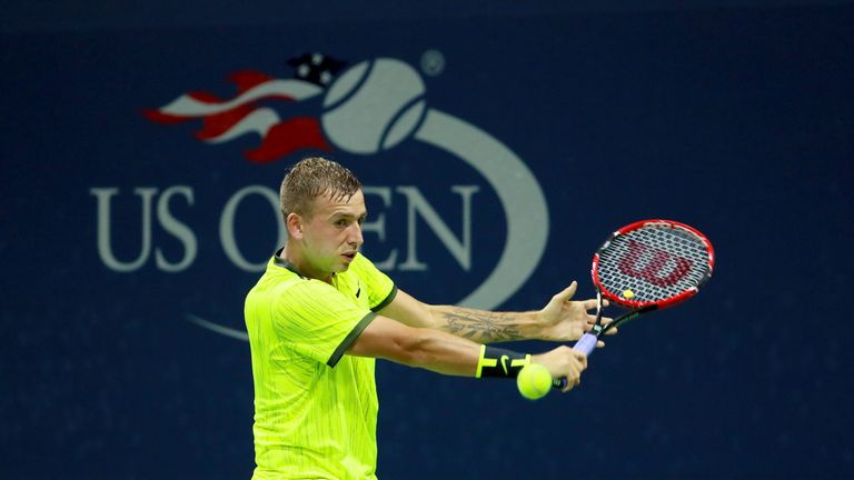 Daniel Evans returns a shot to Alexander Zverev