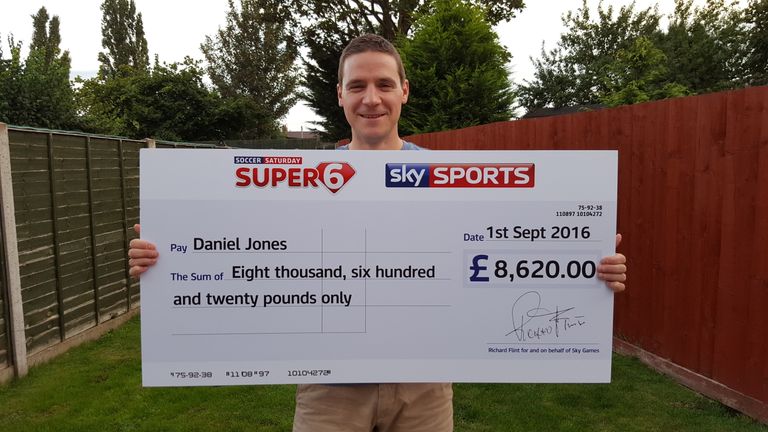 Daniel Jones from Hereford with his cheque for £8,620