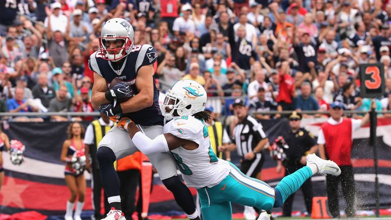 Danny Amendola #80 of the New England Patriots scores a touchdown against Bobby McCain #28 of the Miami Dolphins