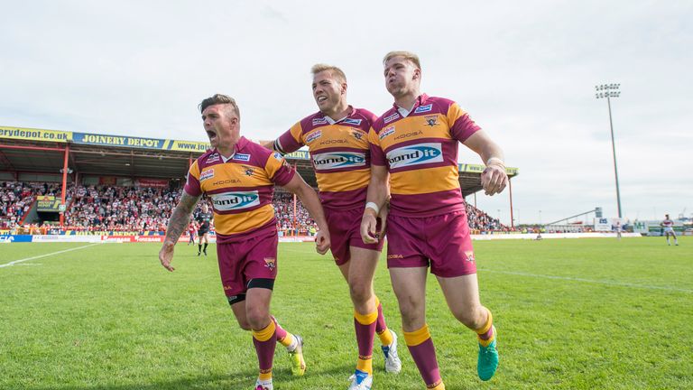 Huddersfield's Danny Brough, Ryan Hinchcliffe & Aaron Murphy celebrate victory over Hull KR to keep them in Super League next year