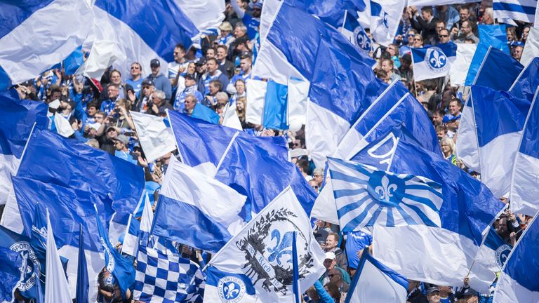 DARMSTADT, GERMANY - MAY 14: The fans of SV Darmstadt 98 wave flags during the first bundesliga match between SV Darmstadt 98 and Borussia Moenchengladbach