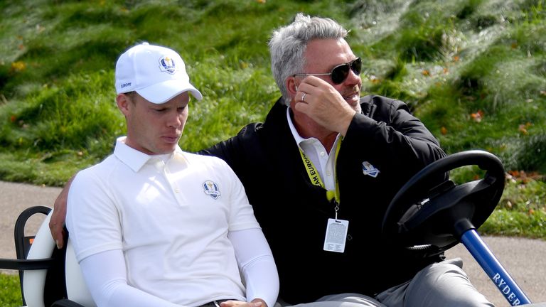 Captain Darren Clarke of Europe drives Danny Willett in a cart during practice prior to the 2016 Ryder Cup at Hazeltine National