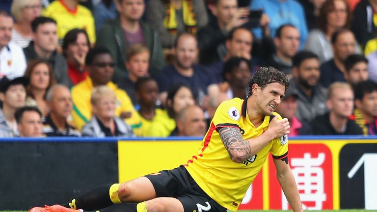 WATFORD, ENGLAND - SEPTEMBER 18:  Daryl Janmaat of Watford holds his shoulder after a challenge during the Premier League match between Watford and Manches