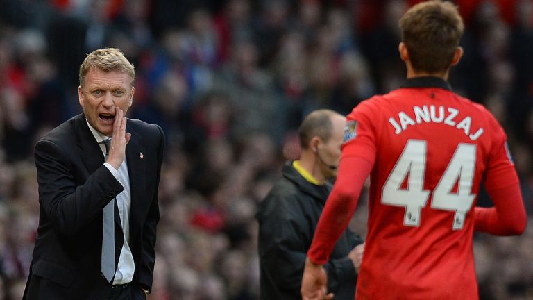 Manchester United Scottish manager David Moyes (L) speaks to Manchester United's Belgium midfielder Adnan Januzaj (R) during the English Premier League foo