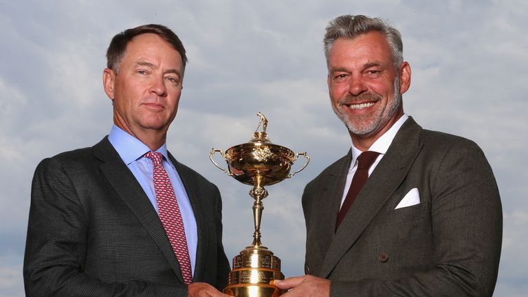 CHASKA, MN - SEPTEMBER 28:  (L-R) Davis Love III, US Ryder Cup Captain and Darren Clarke, European Ryder Cup Captain, pose with the trophy during the 2016 