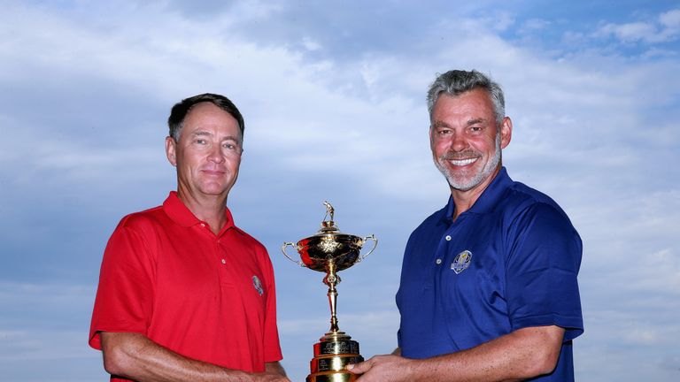CHASKA, MN - SEPTEMBER 28:  (L-R) Davis Love III, US Ryder Cup Captain and Darren Clarke, European Ryder Cup Captain, pose with the trophy during the 2016 
