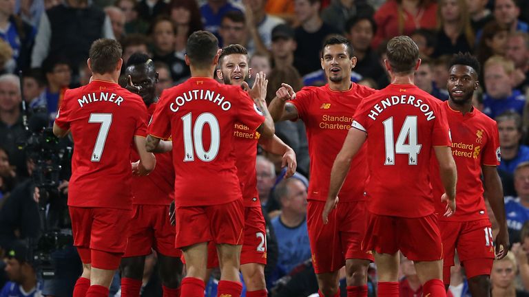 Liverpool's Dejan Lovren (3rd from right) celebrates scoring his side's first goal 