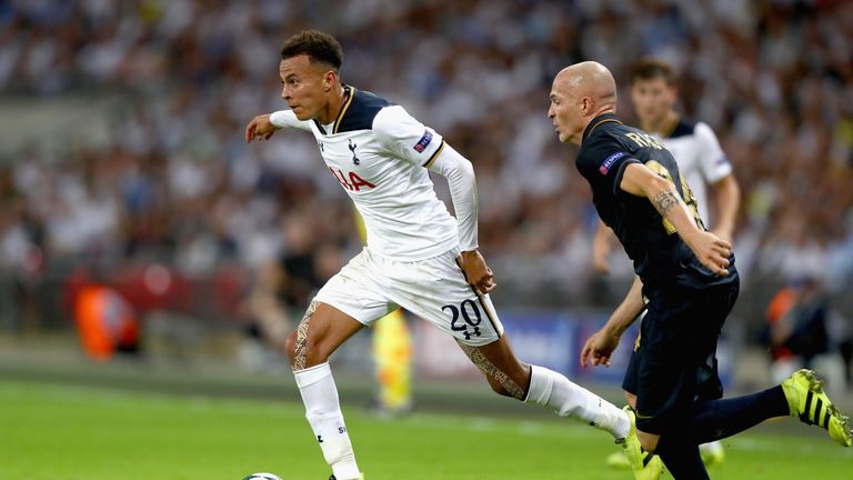 Dele Alli of Tottenham Hotspur (left) takes on Andrea Raggi ofMonaco in the UEFA Champions League at Wembley