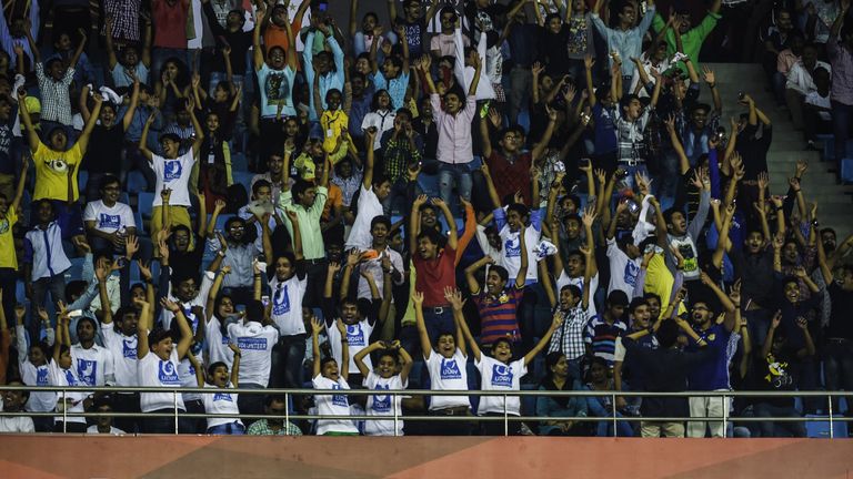 Football fans shout as they attend the Indian Super League (ISL) football match between Delhi Dynamos F.C and Chennaiyin F.C. at The Jawarharlal Nehru Stad