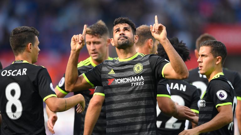 Diego Costa of Chelsea (C) celebrates with team-mates as he scores their first goal during the Premier League match at Swansea