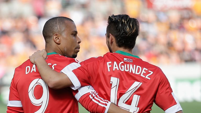 Charlie Davies of New England Revolution with Diego Fagundez (R)