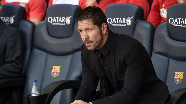 Atletico Madrid's Argentinian coach Diego Simeone looks on during the Spanish league football match FC Barcelona vs Club Atletico de Madrid  at the Camp No