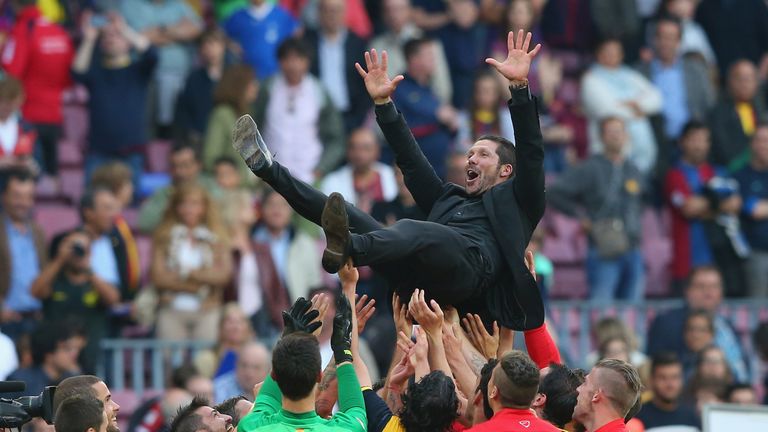 BARCELONA, SPAIN - MAY 17:  Diego Simeone the coach of Club Atletico de Madrid is thrown in the air by his players after winning the La Liga after the matc
