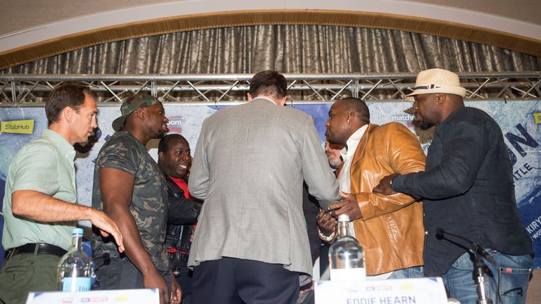 Dillian Whyte (L) and Ian Lewison face each other down