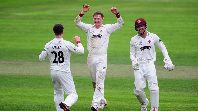 Dom Bess of Somerset celebrates the wicket of Jeetan Patel 